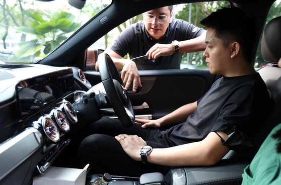 Demonstration of the features of Mercedes-Benz's range of EV, the Mercedes-EQ to attendees.