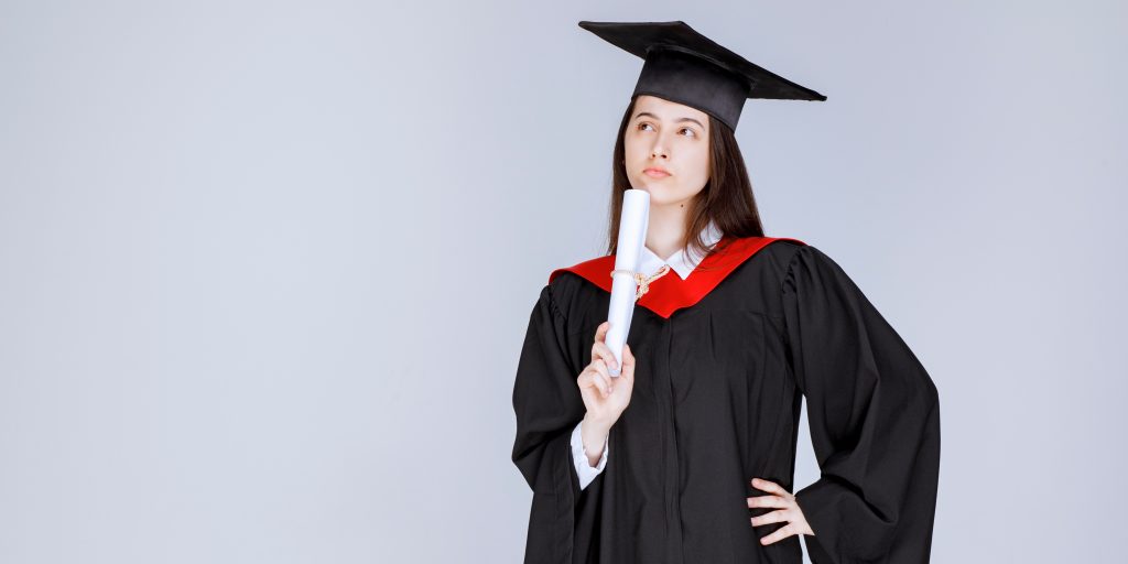 Graduates in thinking pose